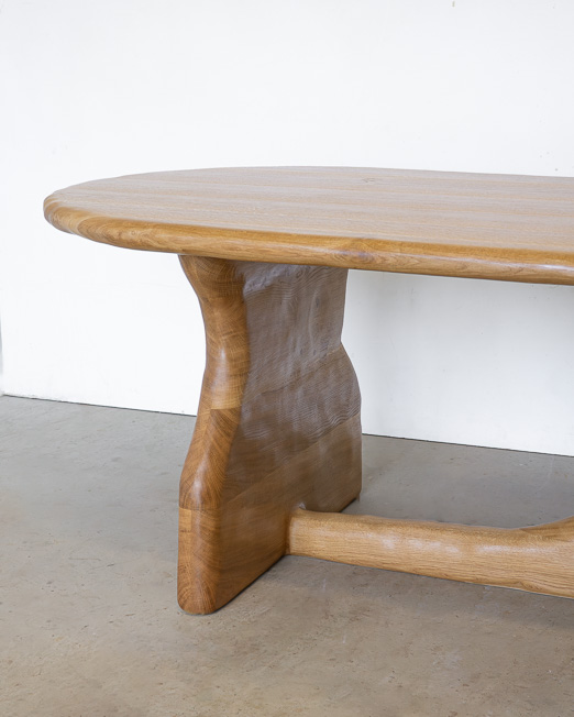 curved dining table in oak