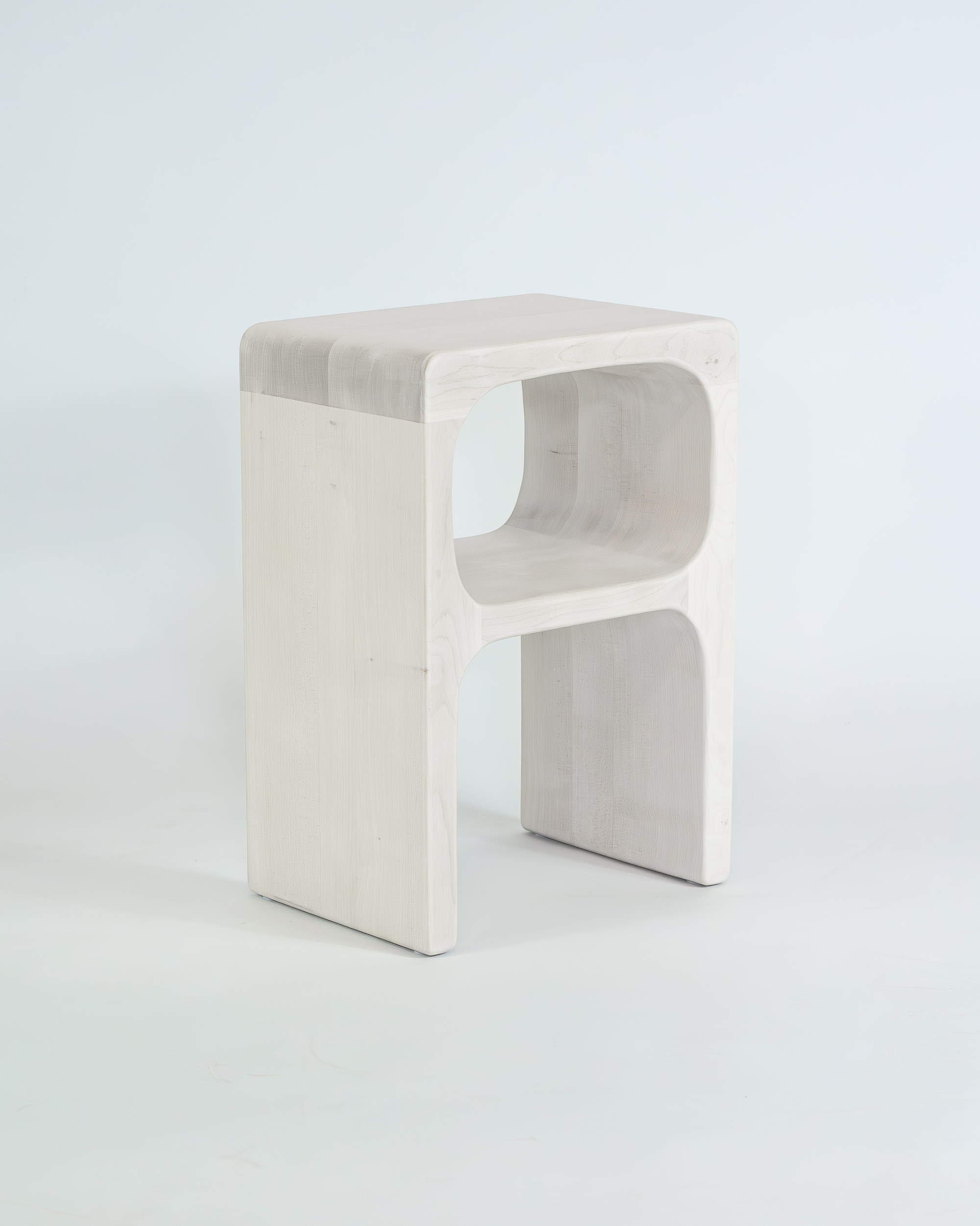 sculpted side table in bleached maple