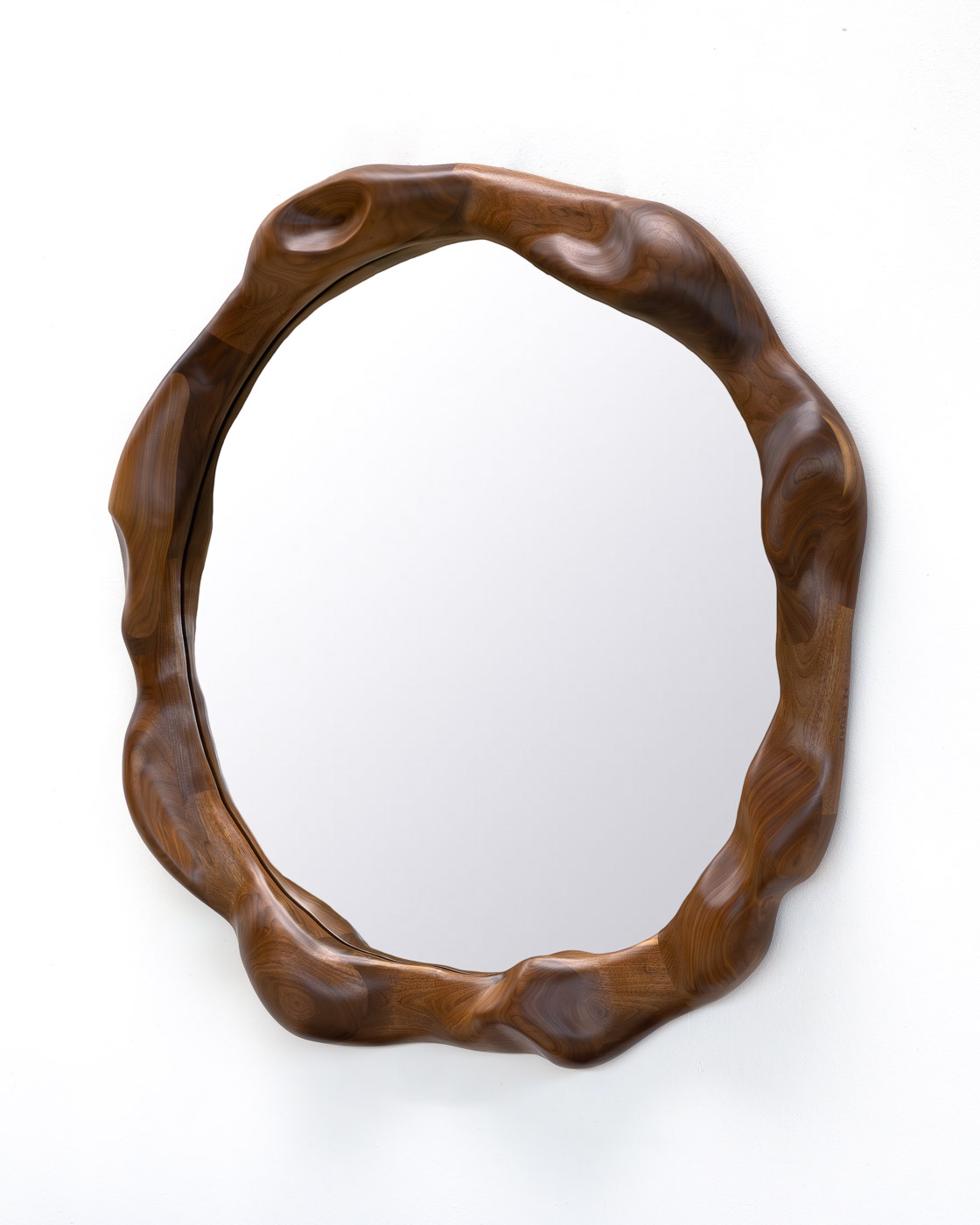 organic shaped mirror in walnut