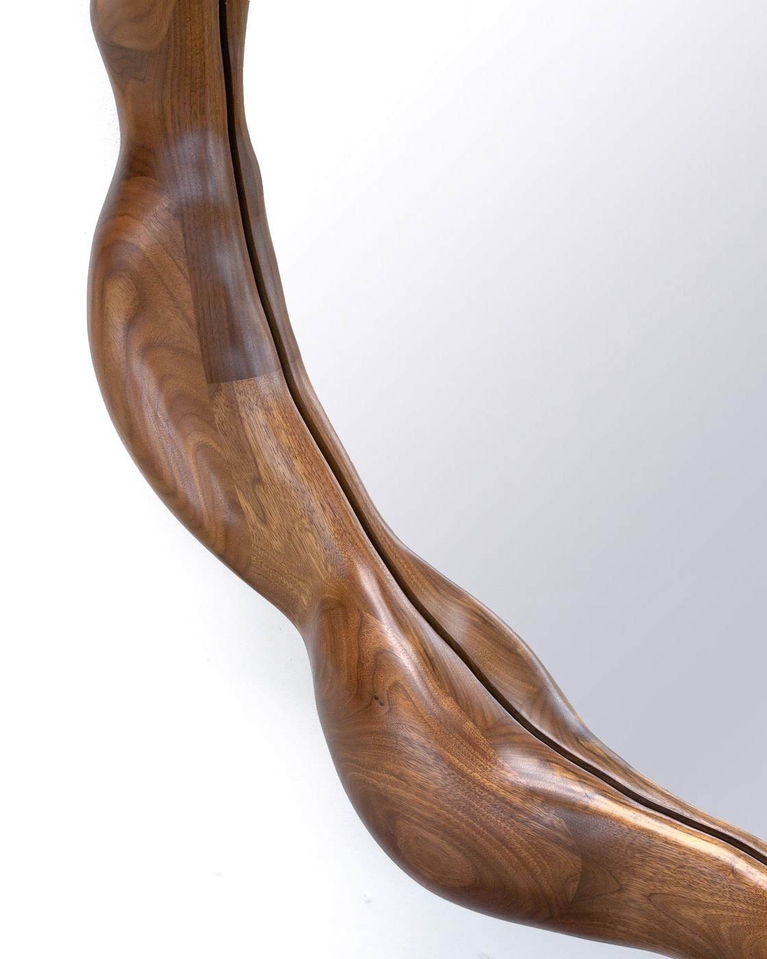 organic shaped mirror in walnut