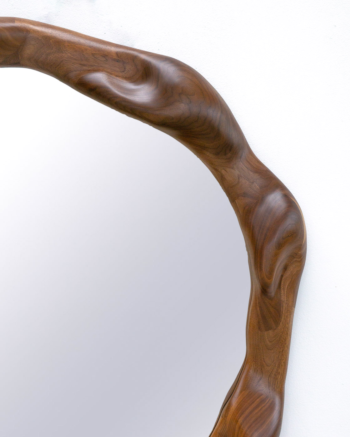 organic shaped mirror in walnut