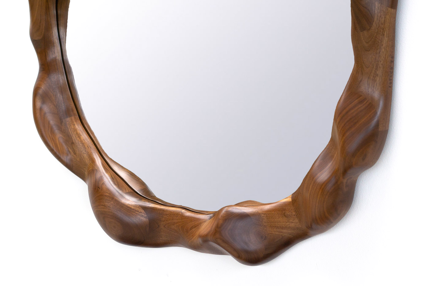 organic shaped mirror in walnut