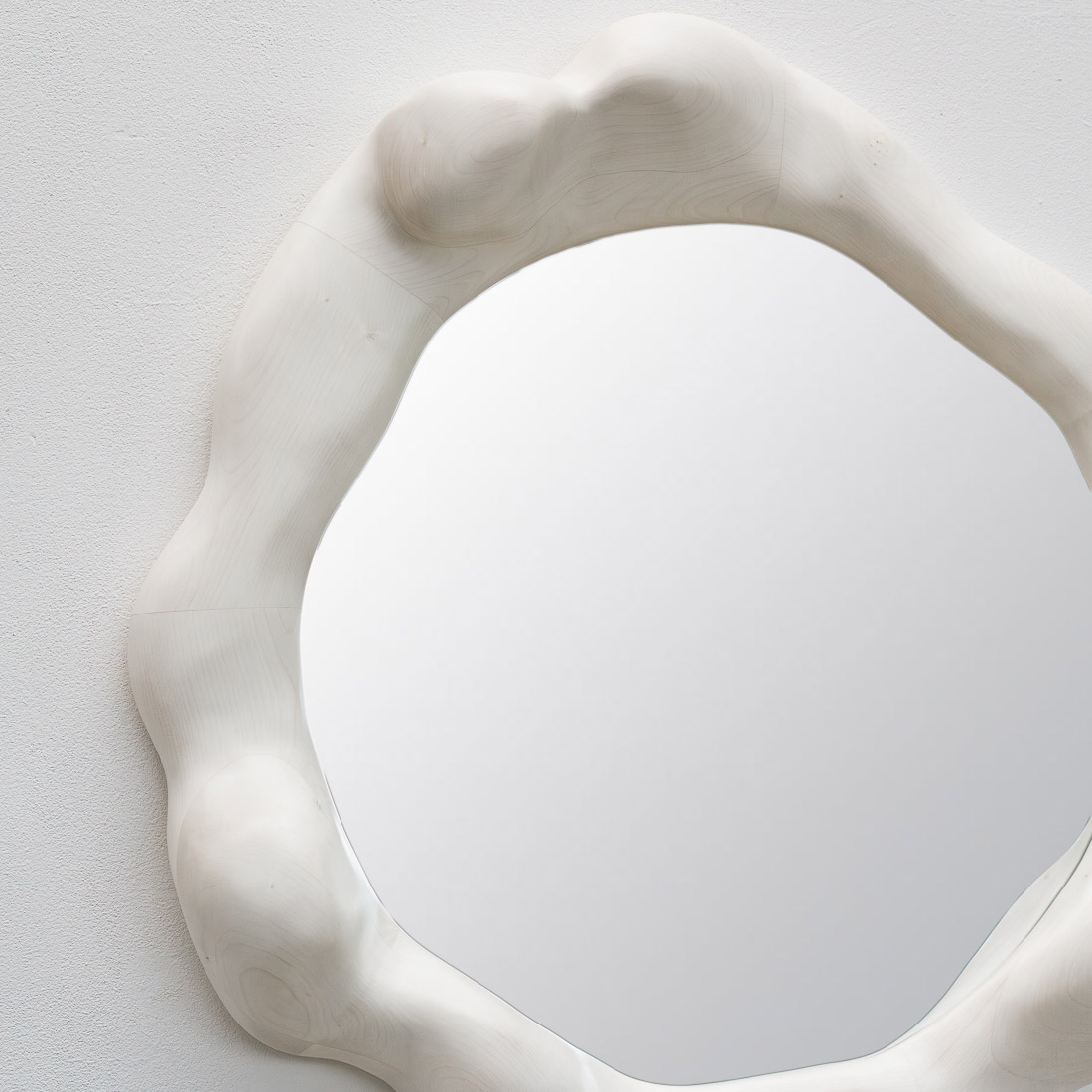 sculptural mirror in bleached maple