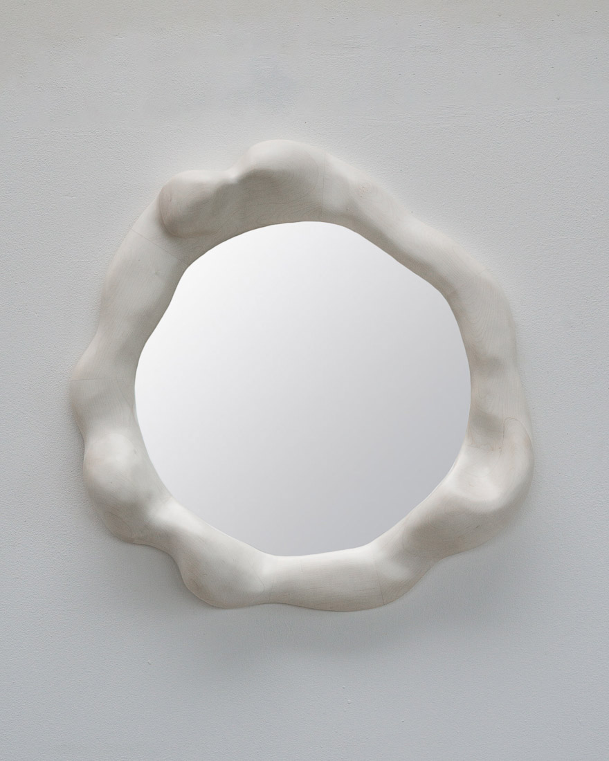 sculptural mirror in bleached maple