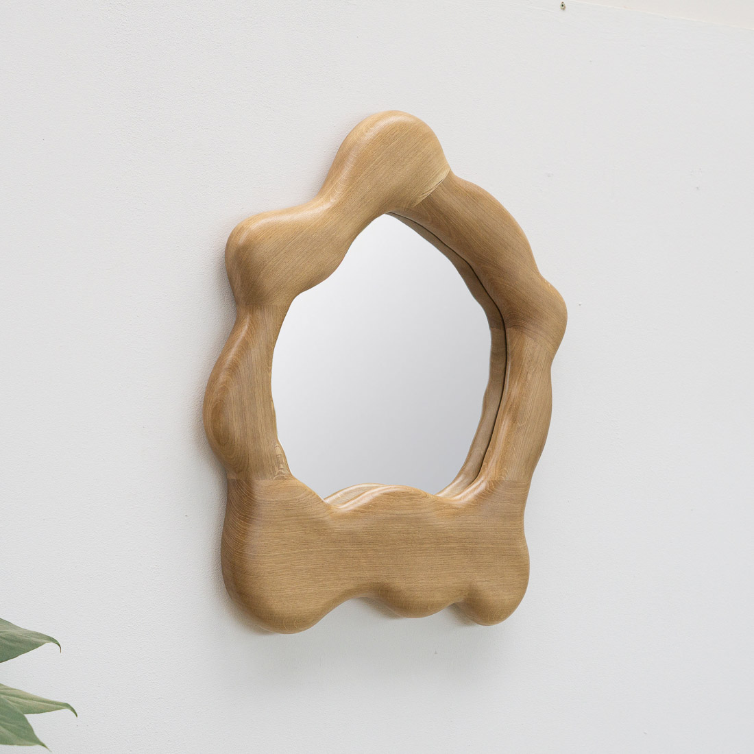 sculptural mirror in oak wood