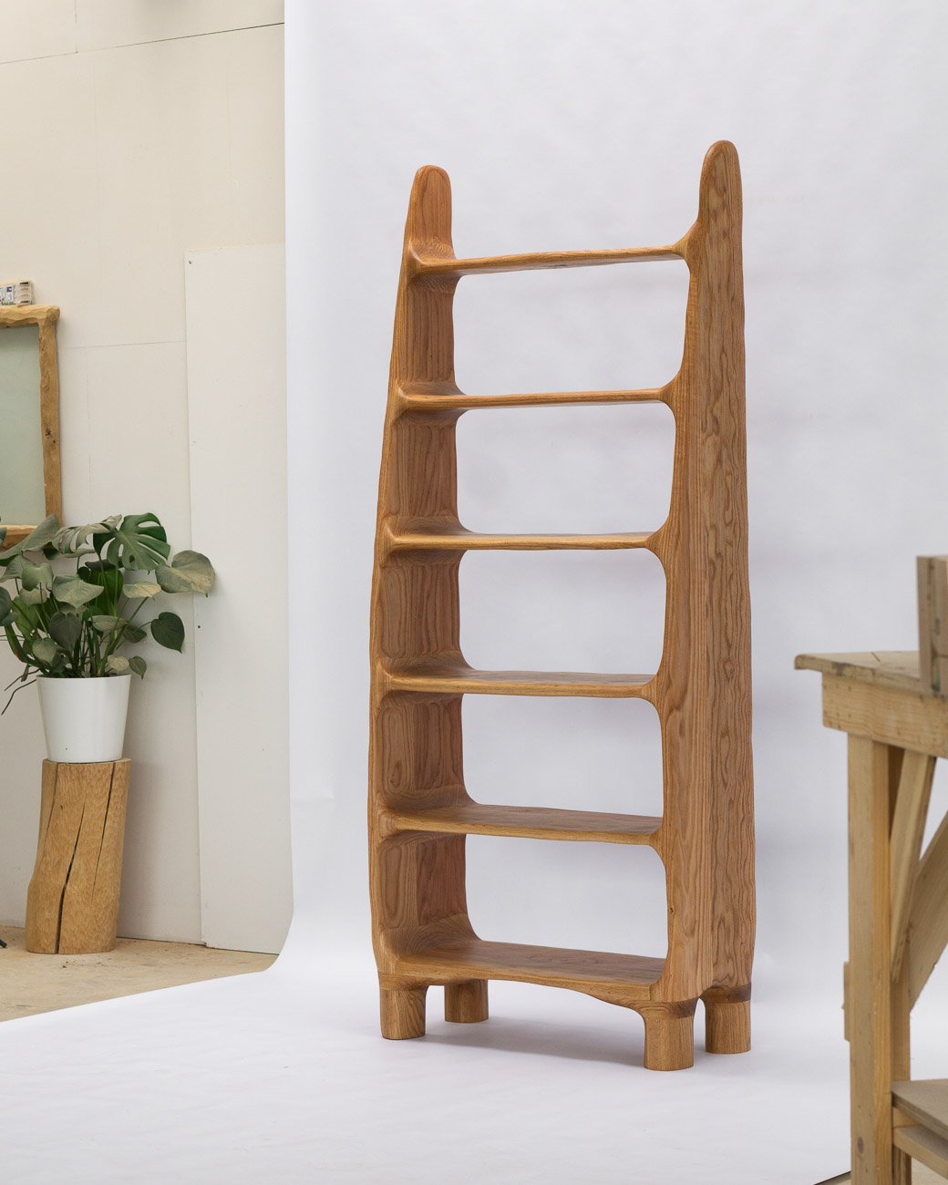 sculptural shelf made of red oak wood