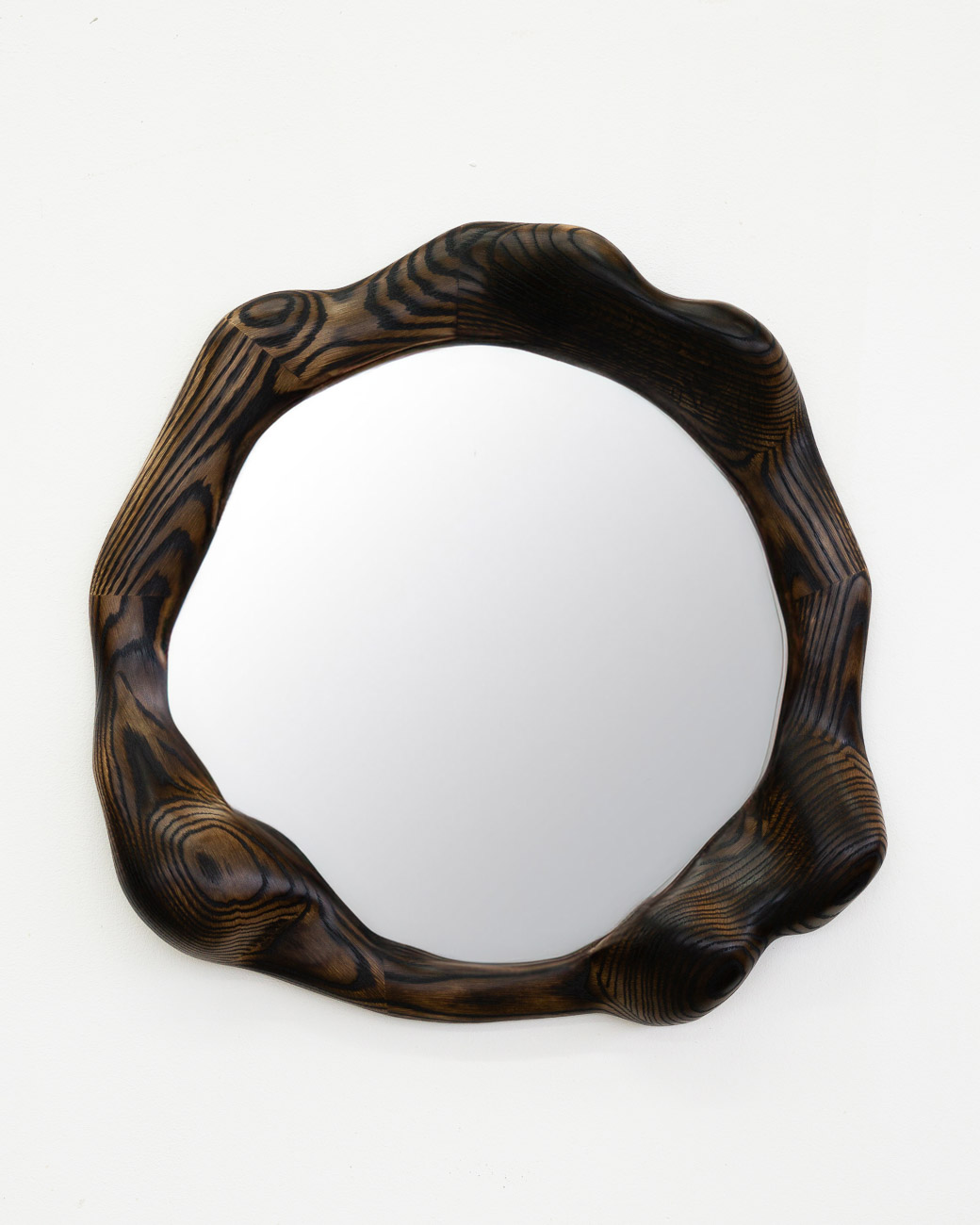 Round mirror in charred oak