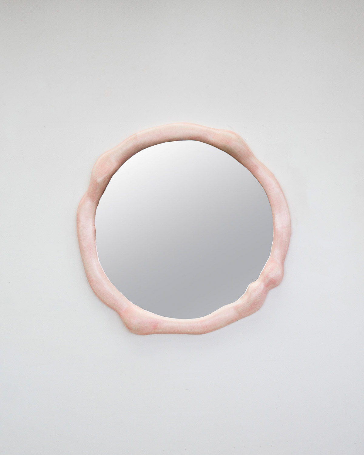 mirror sculptural in rosa painted maple