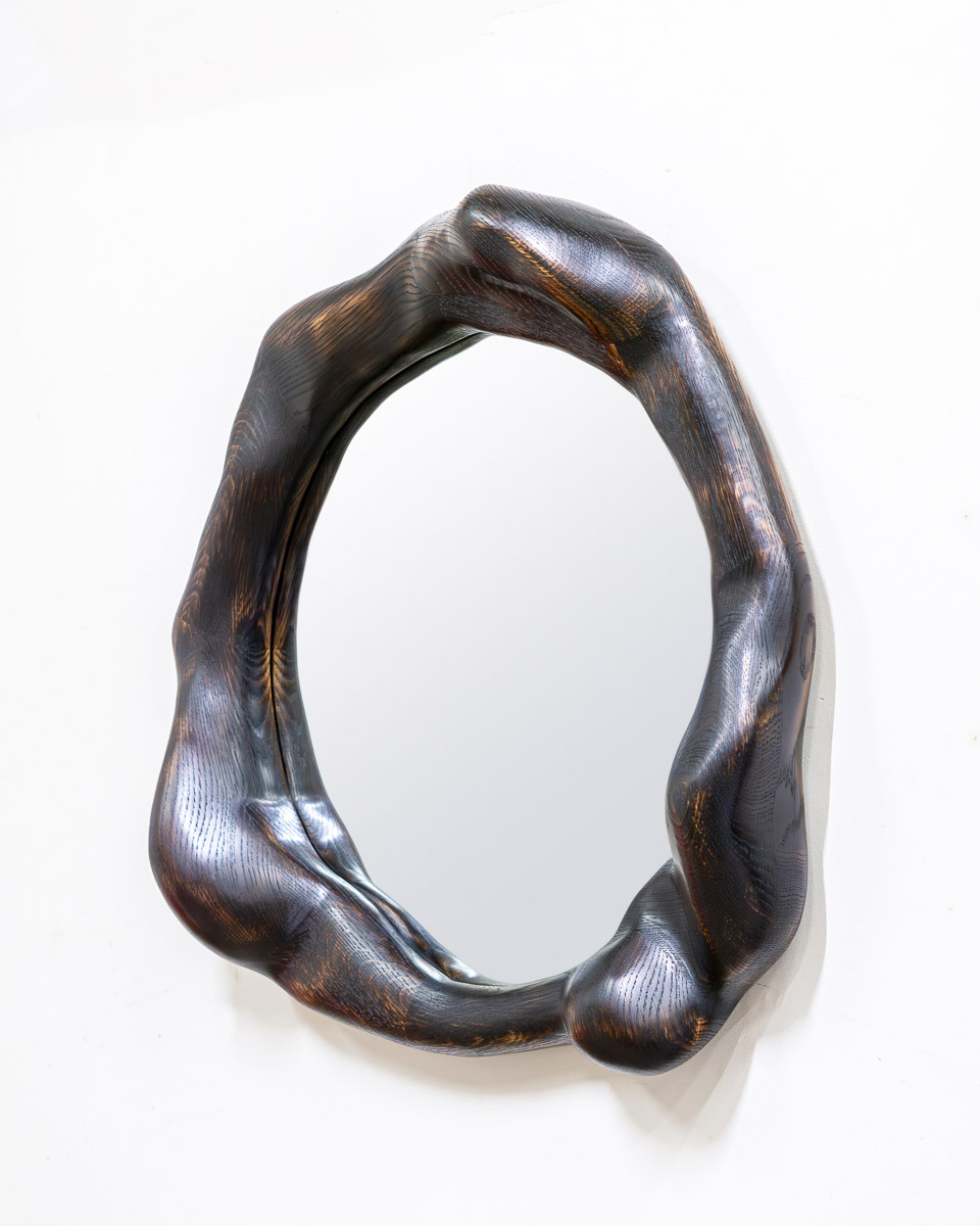 wavy mirror in charred oak