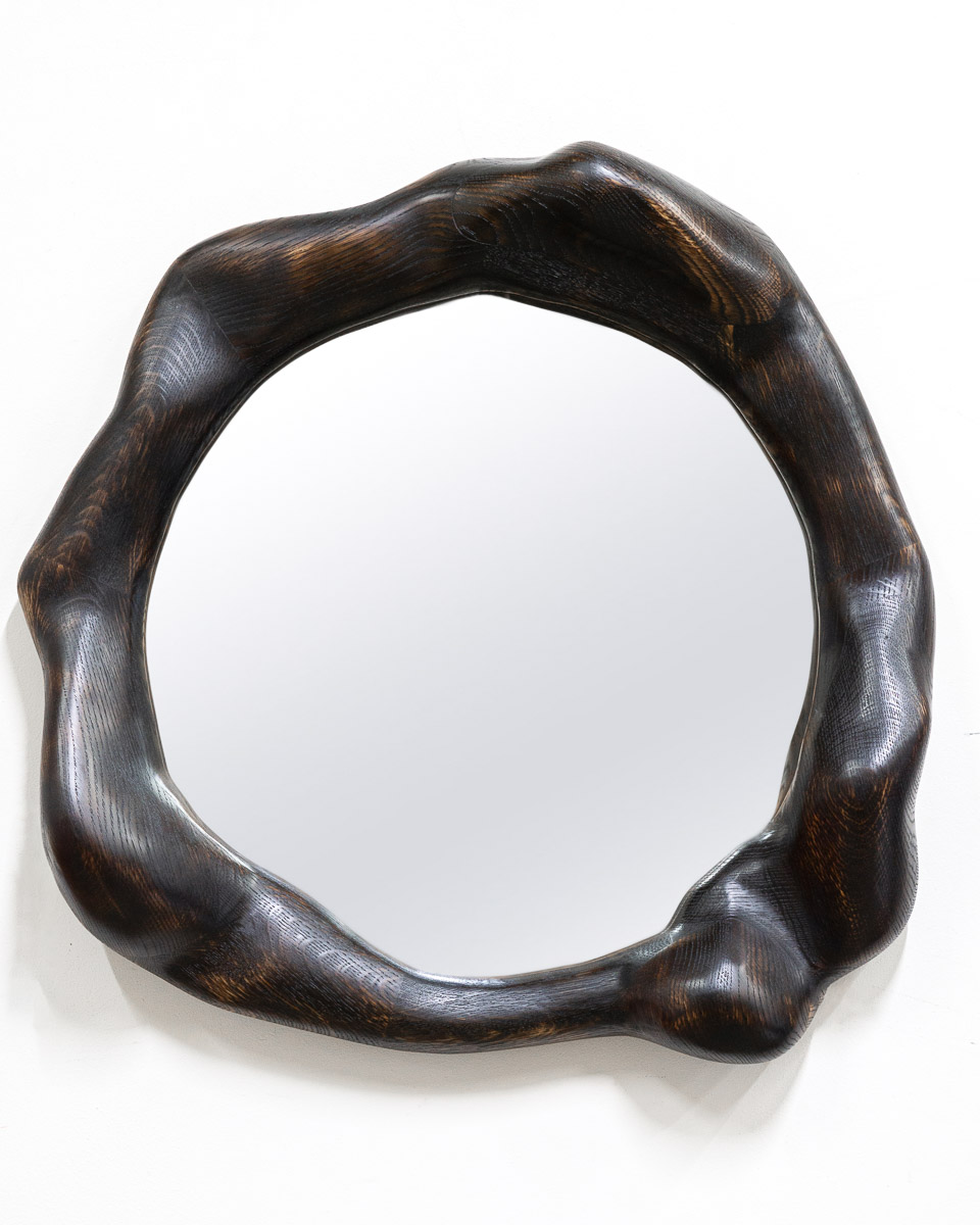 wavy mirror in charred oak