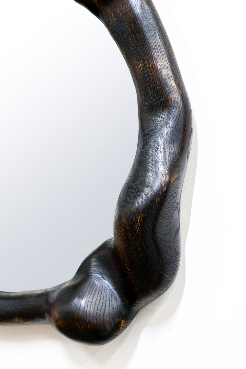 wavy mirror in charred oak