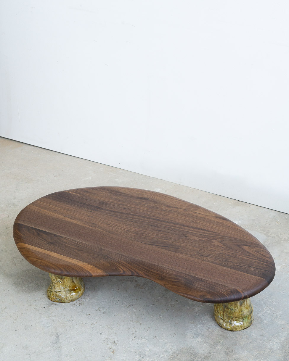 coffee table in walnut with green ceramic legs