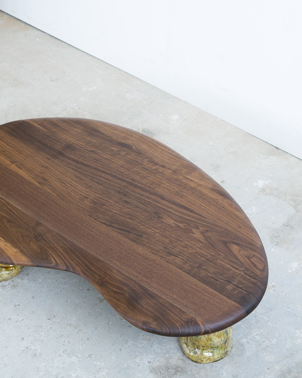 coffee table in walnut with green ceramic legs