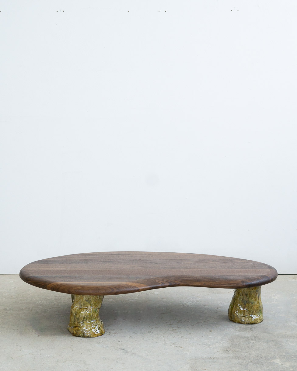 coffee table in walnut with green ceramic legs