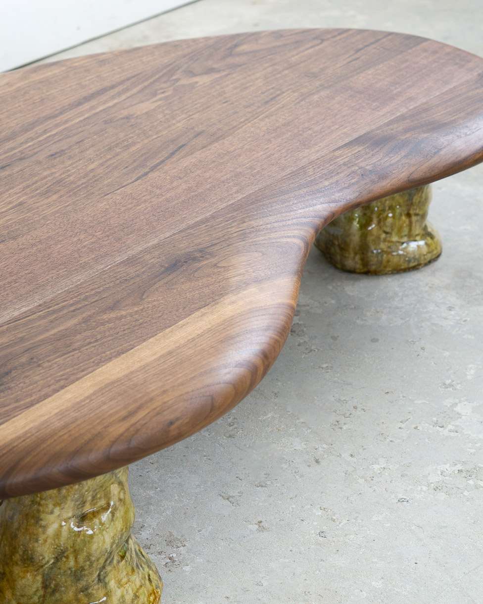 coffee table in walnut with green ceramic legs