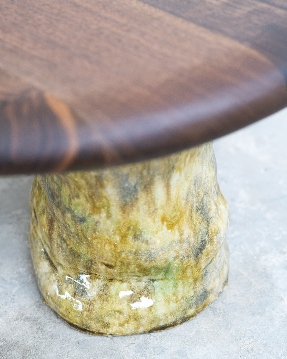 coffee table in walnut with green ceramic legs