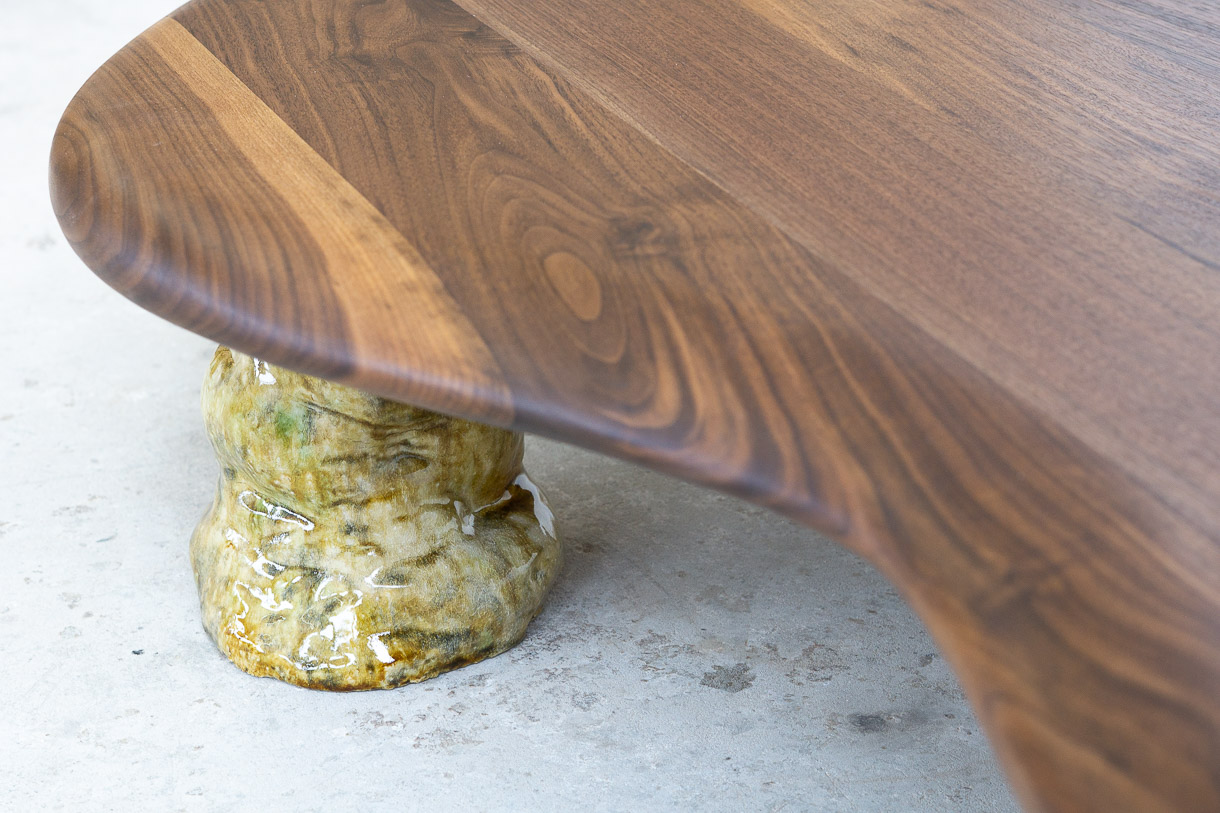 coffee table in walnut with green ceramic legs
