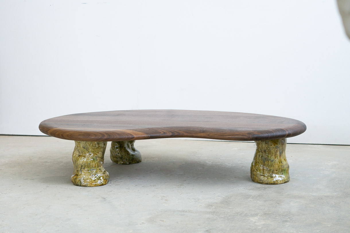 coffee table in walnut with green ceramic legs