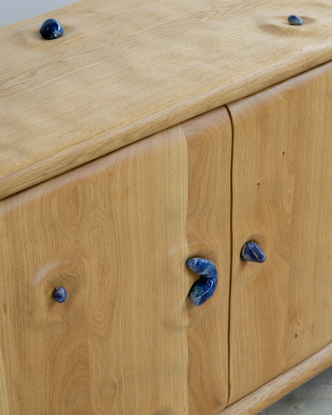 credenza in white oak with blue ceramic inlays