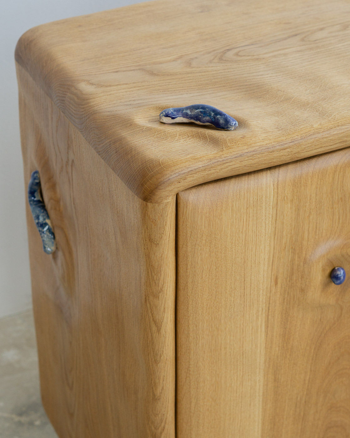credenza in white oak with blue ceramic inlays