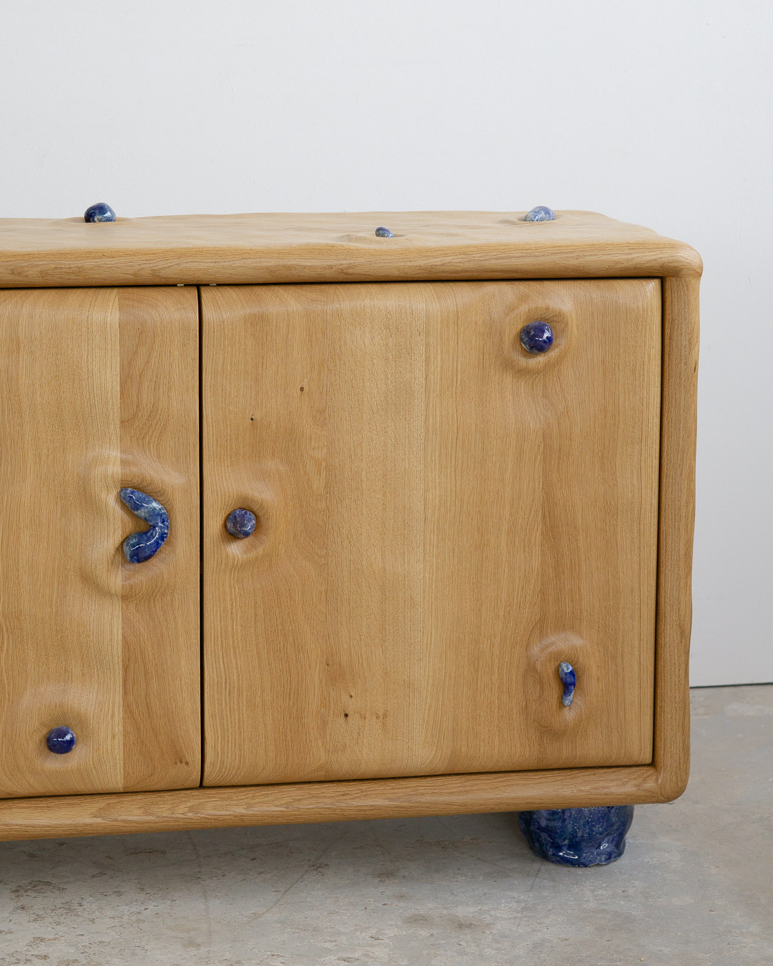credenza in white oak with blue ceramic inlays