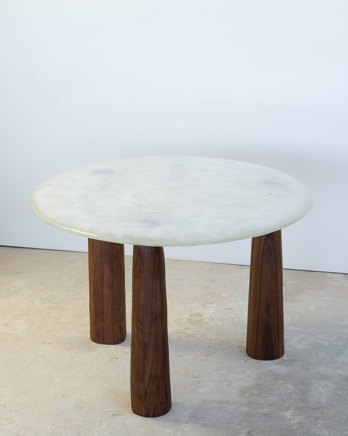 fused glass dining table with opaque glass and walnut legs