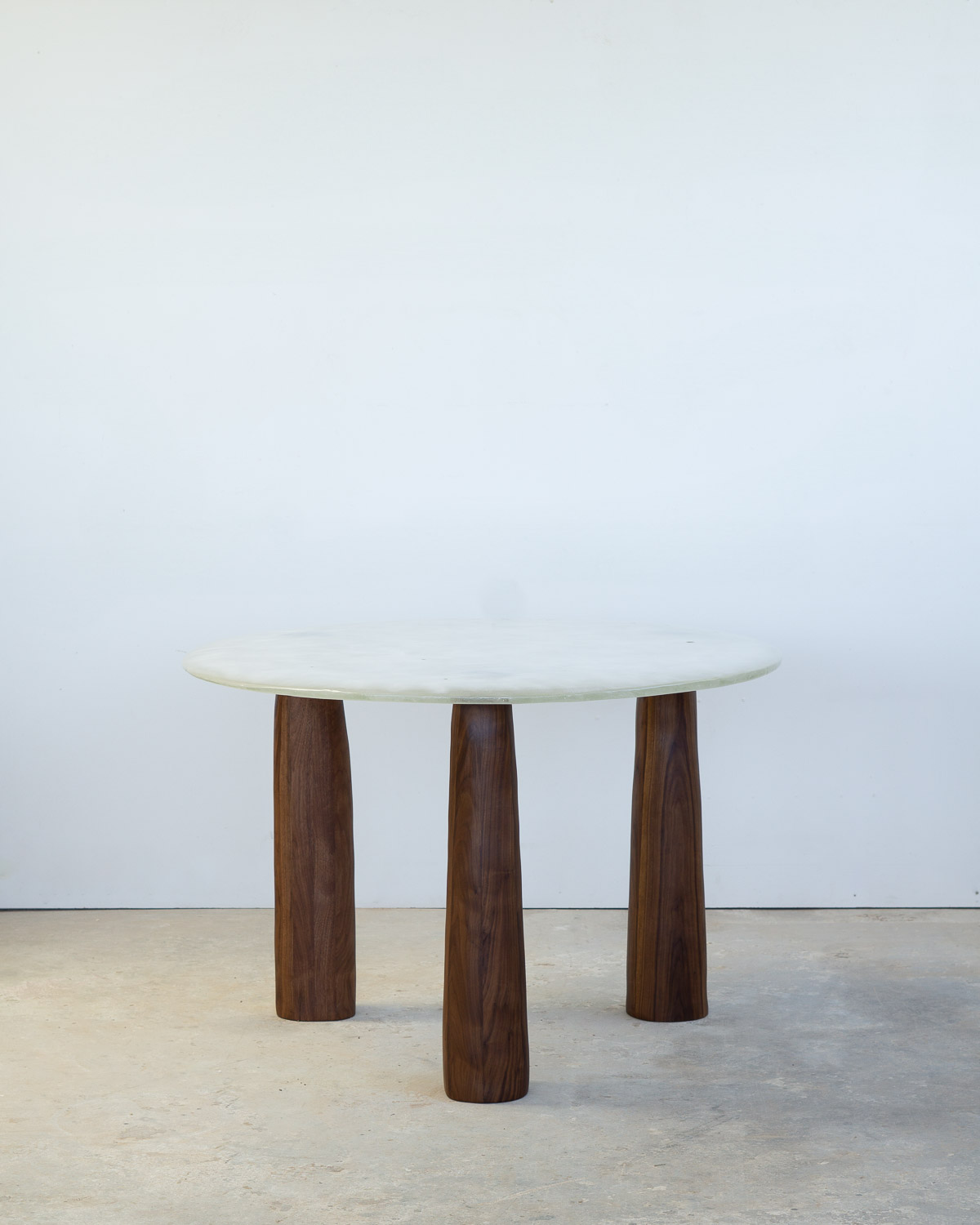 fused glass dining table with opaque glass and walnut legs