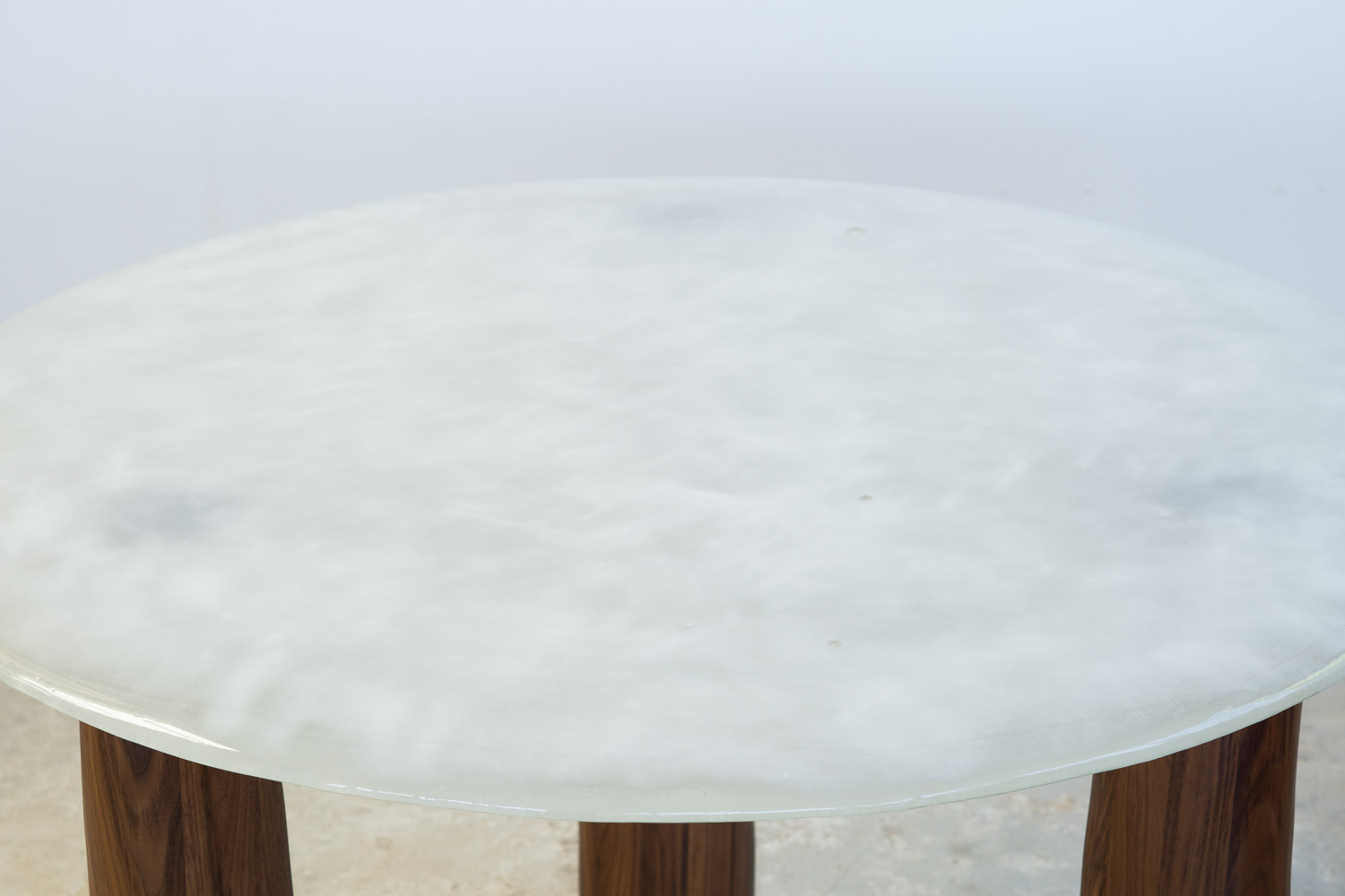fused glass dining table with opaque glass and walnut legs