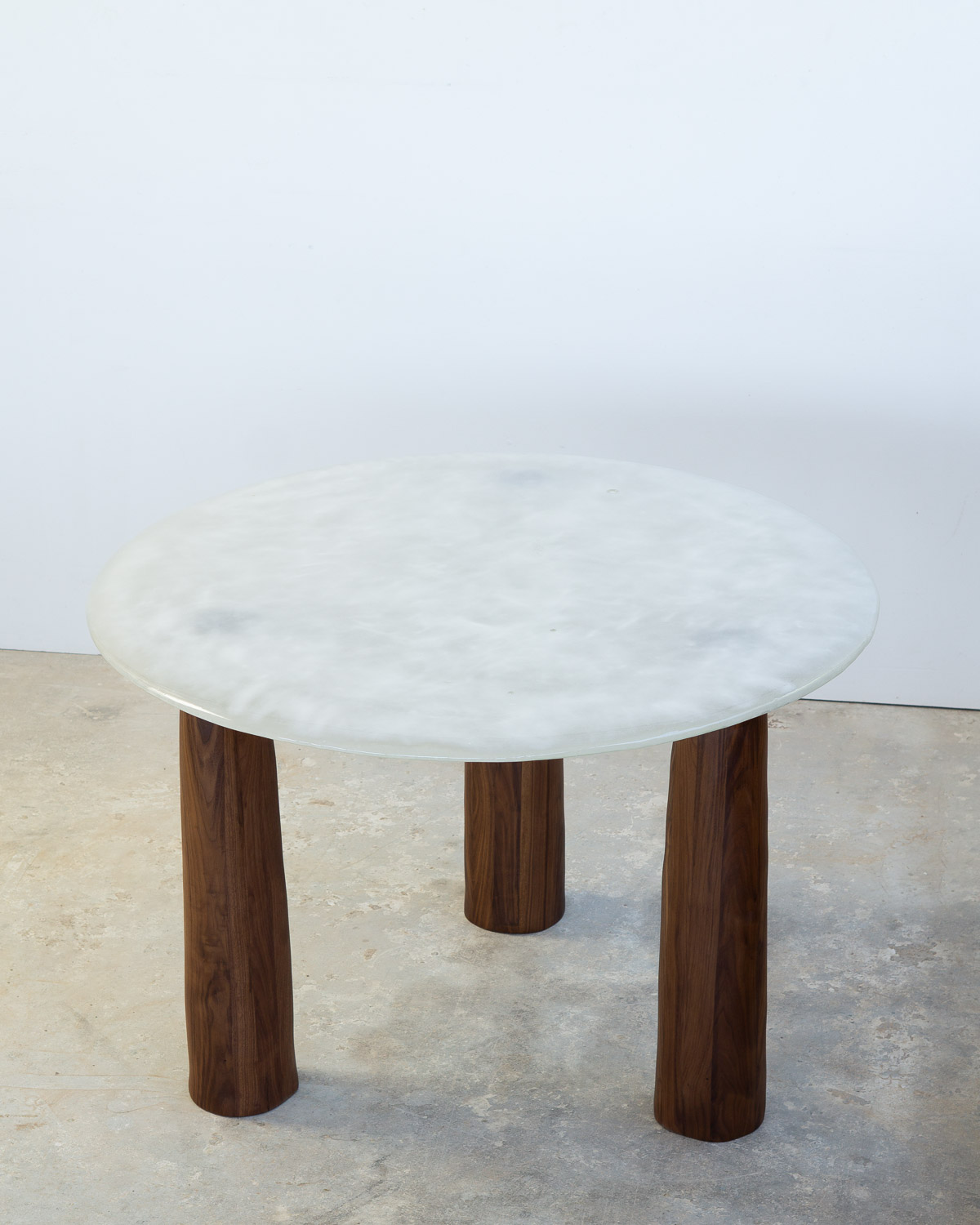 fused glass dining table with opaque glass and walnut legs