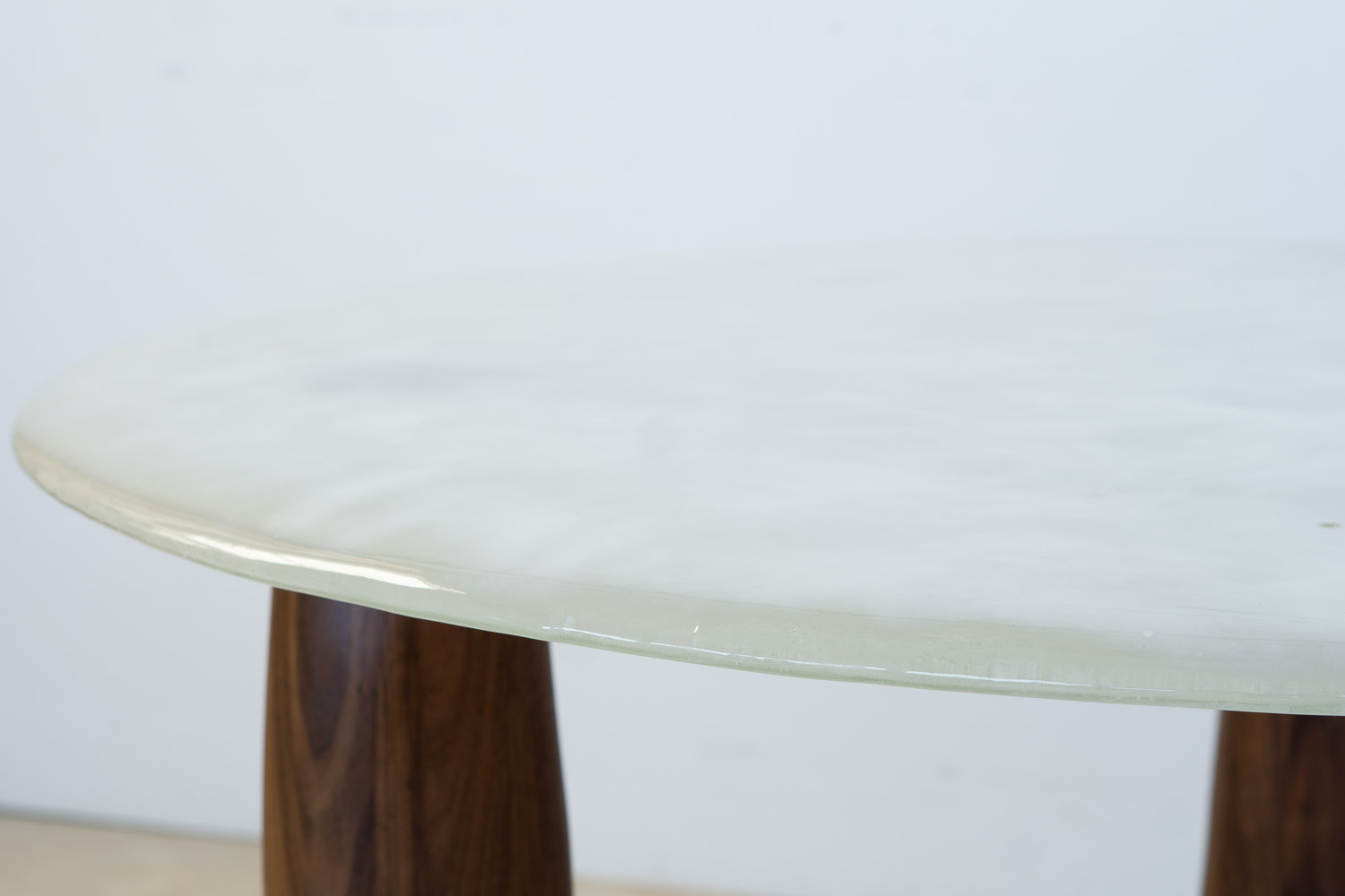 fused glass dining table with opaque glass and walnut legs