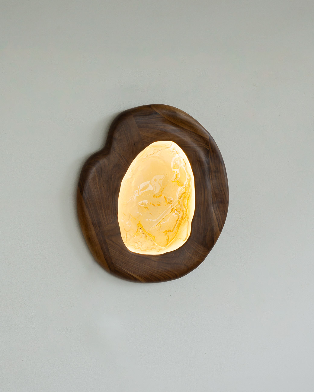 sconce made from kiln-cast glass & natural walnut