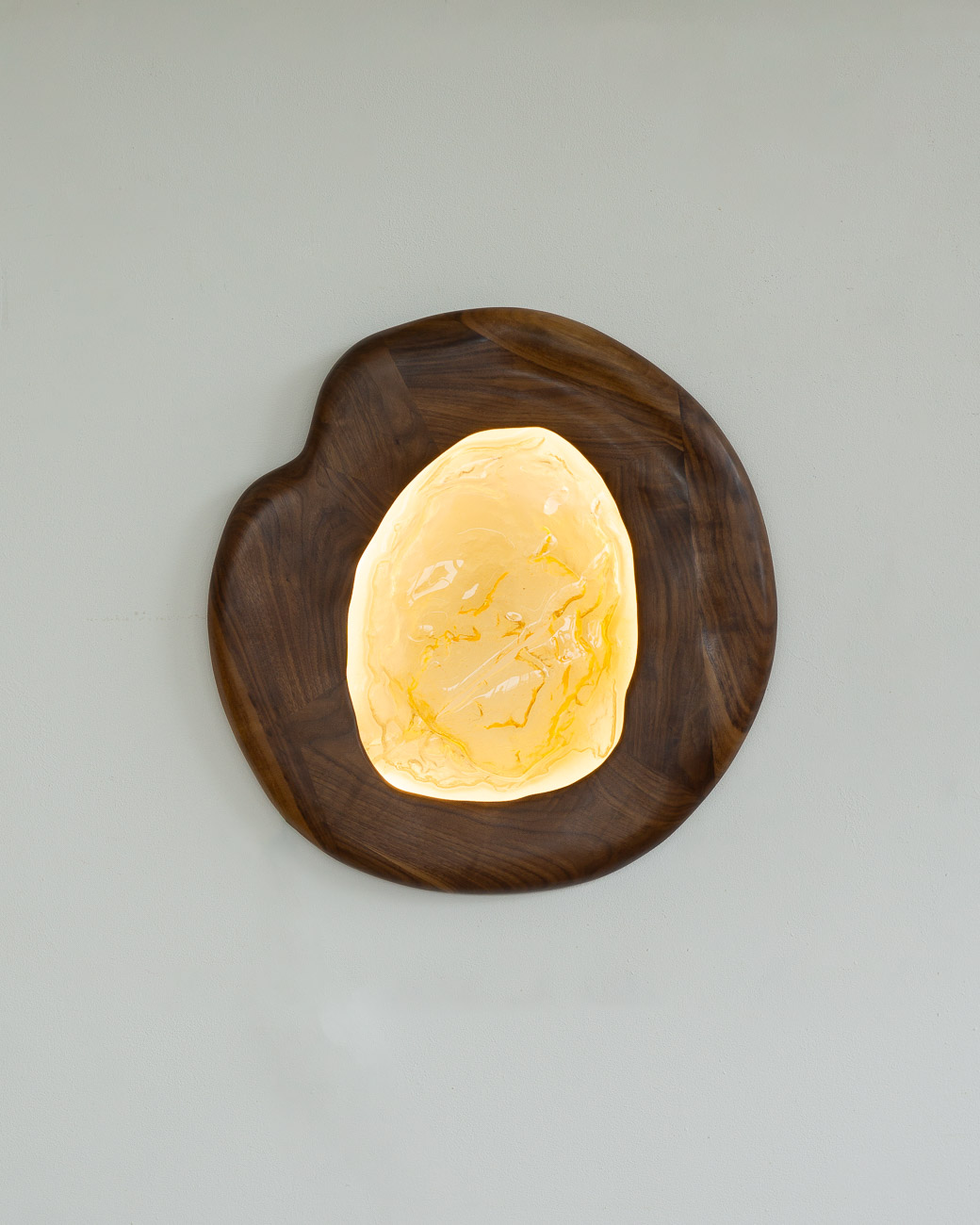 sconce made from kiln-cast glass & natural walnut