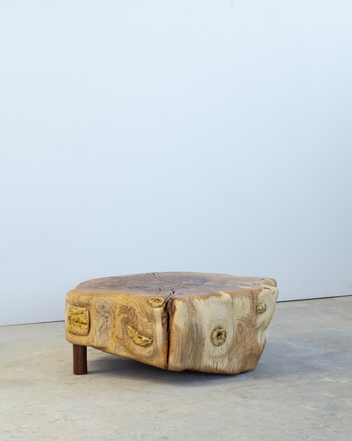 wooden stump with ceramic inlays