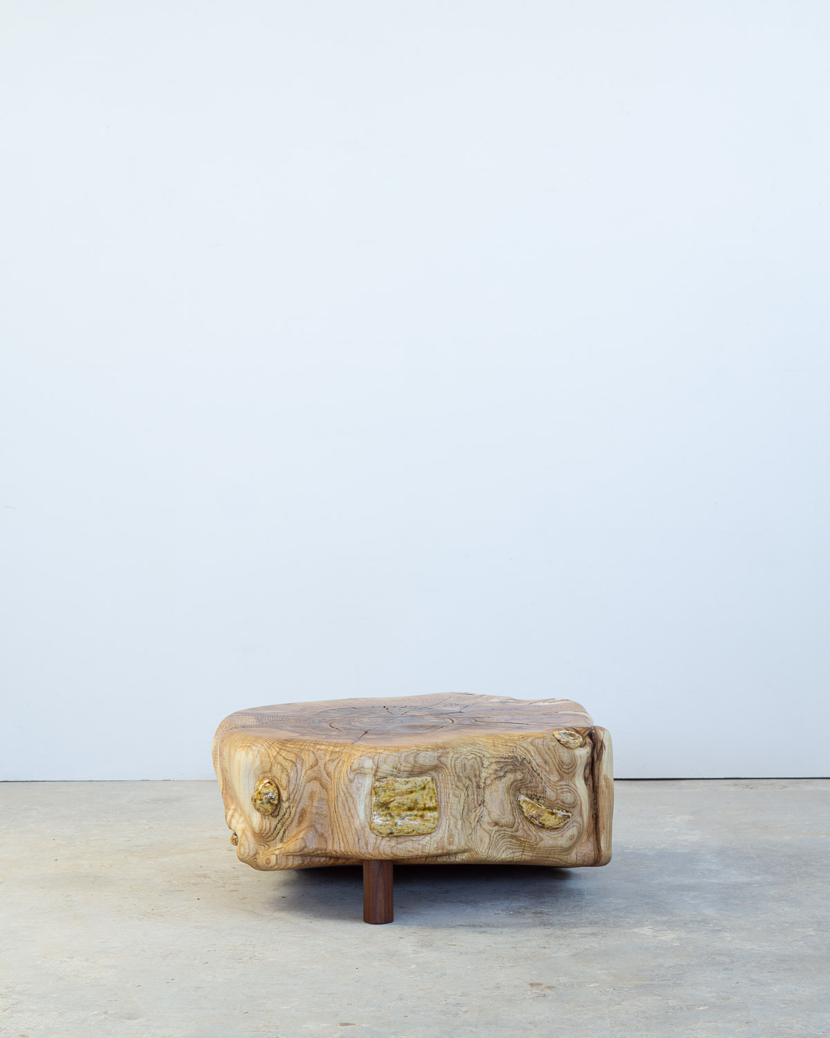 wooden stump with ceramic inlays
