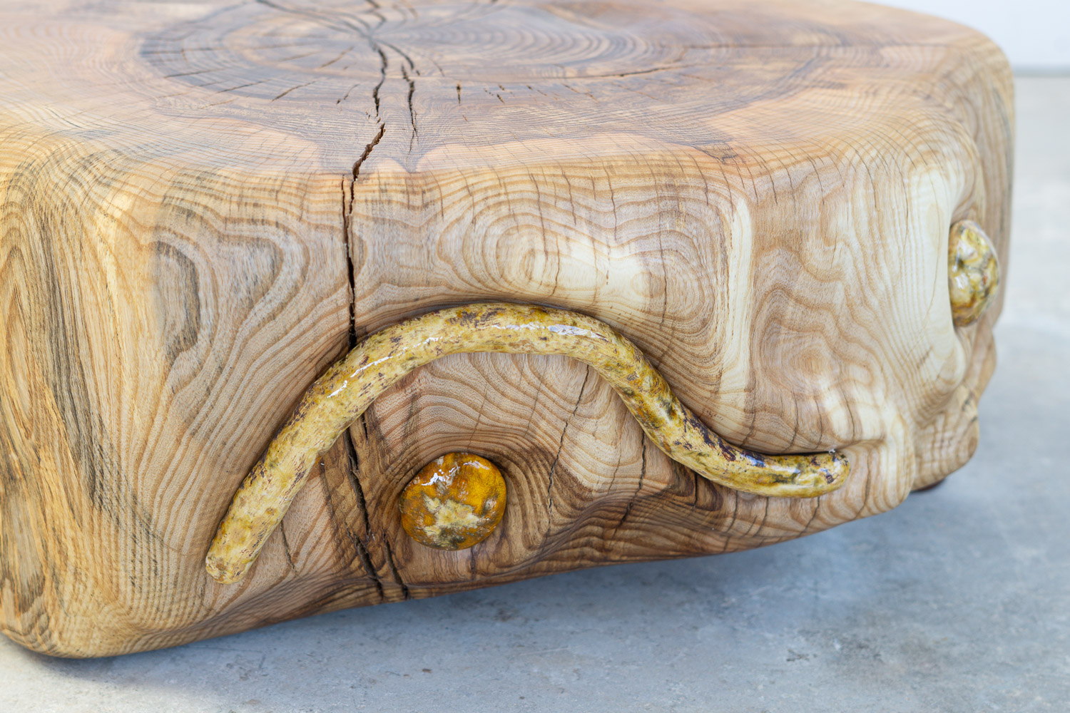 wooden stump with ceramic inlays