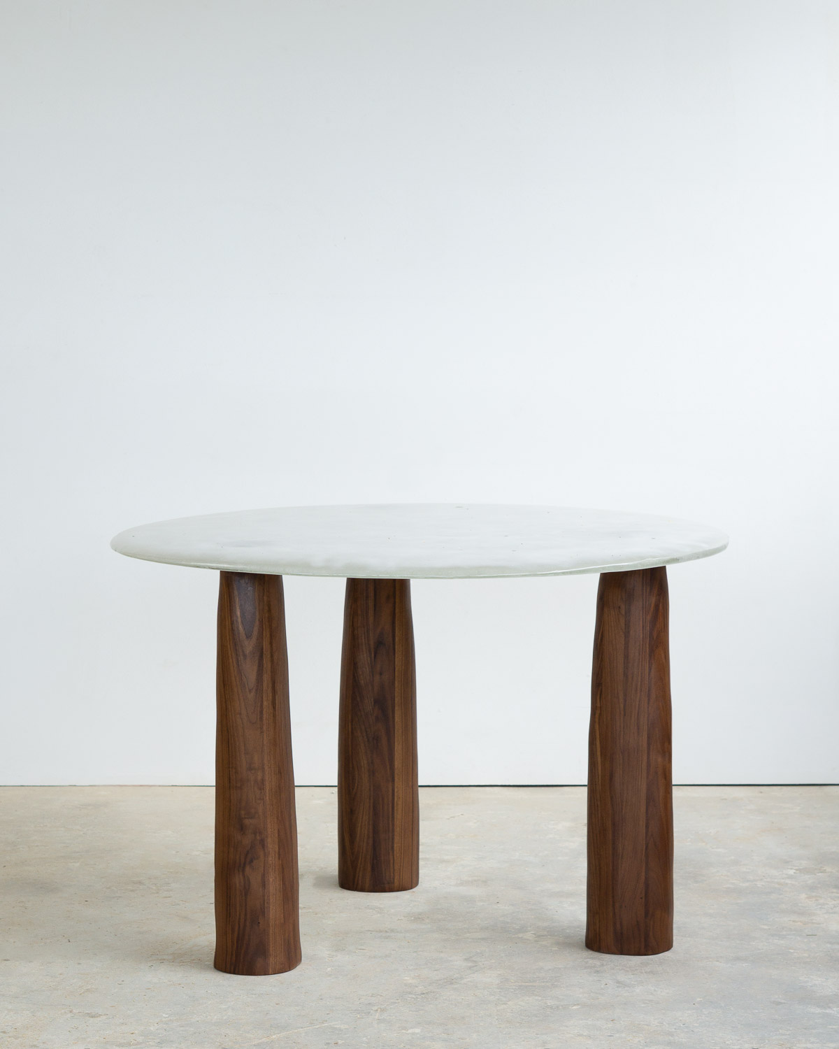 fused glass dining table with opaque glass and walnut legs